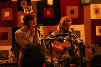Henry Bartholomay, FCRH ’14, (left) and Sean Lemkey , FCRH ’14, (right), showcase their bluesy rock music style during a set at Rodrigues Coffee House. (Photo Courtesy of King Mulhacen)