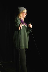 A Fordham female comedian gives a rousing performance in the Blackbox. (Tessa Bloechl/The Ram)