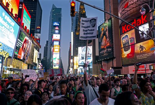 Marchers congregate in Times Square, protesting George Zimmerman's acquittal in the killing of 17-year-old Trayvon Martin. Mostly peaceful demonstrations occurred across the nation. (Photo by Craig Ruttle/AP)
