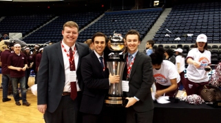 DJ Sixsmith, Kenny Ducey, FCRH'15 and Michael Watts, GSB'15 hold the A-10 women's basketball trophy. (Courtesy of DJ Sixsmith)