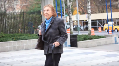 One of Fordham University's oldest students walks to Lincoln Center for a day of classes with the College at 60 program. (Courtesy of University Herald). 