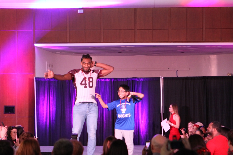 Student Athletes, Olympians Strut the Catwalk at Red Out Fashion Show